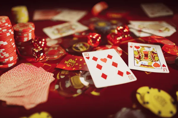 A man focused on his laptop with live stats in the background, highlighting the dedicated sports and gaming features of the TKPKK mobile app.